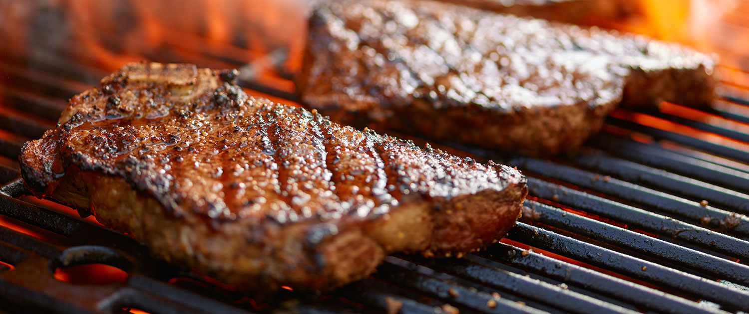 steaks on grill