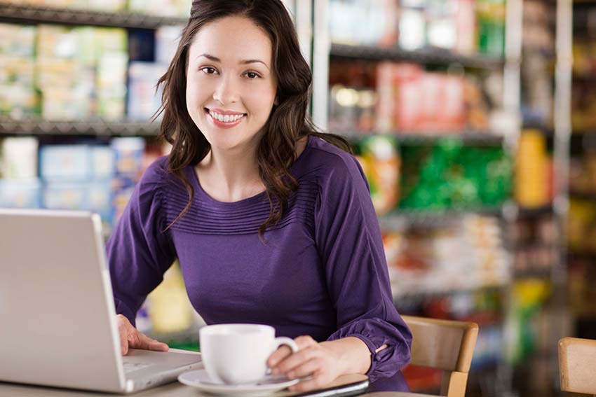 Woman At Computer With Coffee